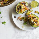 This stuffed avocado is packed with pico de gallo, corn and black beans. Salty, spicy, creamy and deceptively filling, try it as midday snack or light lunch.