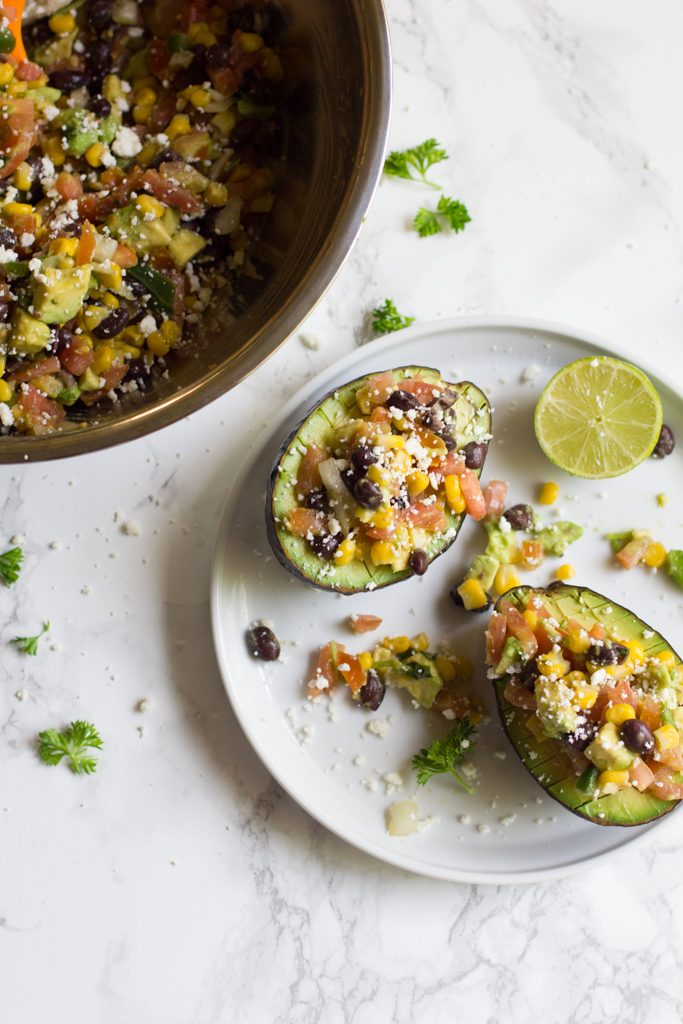 Avocados stuffed with my favorite veggies and beans. The perfect afternoon or post-workout snack.