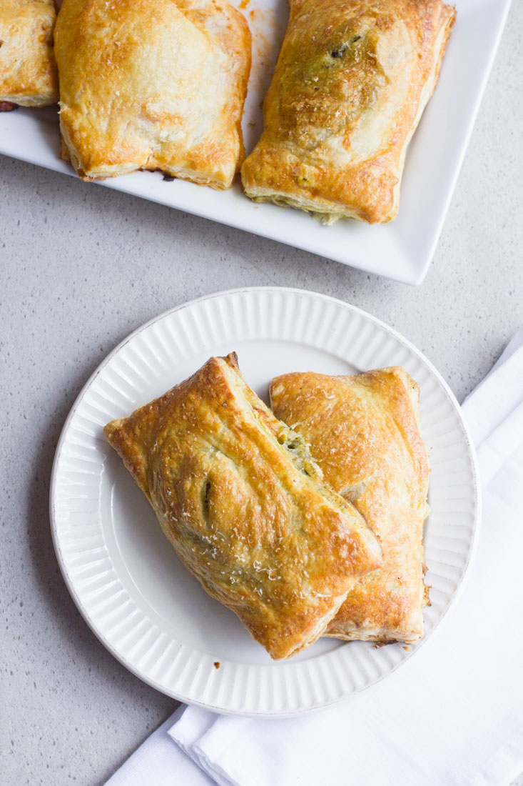 Pesto Chicken Copy Cat Hot Pockets are an excellent alternative to the store bought version. Use your own puff pastry or the recipe included and swap the ingredients to make it your own!