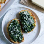 Spinach Asiago Bruschetta is a quick and easy appetizer with spinach and asiago cheese. Great for when you want something a little different than typical bruschetta.