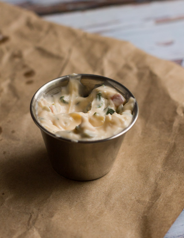 An easy and delicious homemade sriracha tartar sauce with a fresh, bold flavor. Who knew making it from scratch could be so easy!
