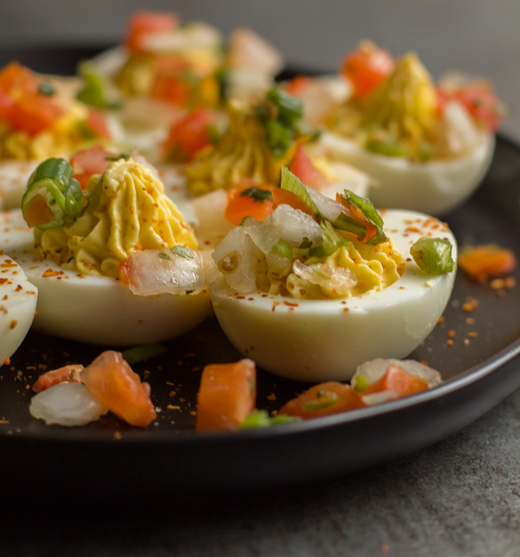 deviled eggs topped with pico de gallo