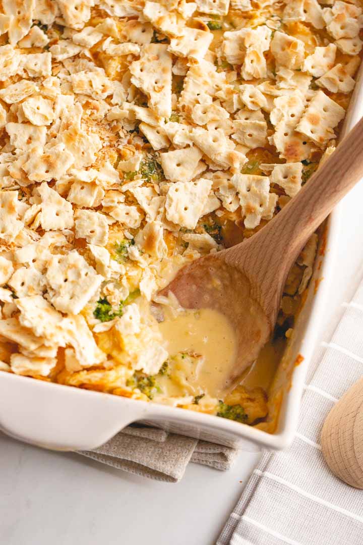 broccoli cheddar casserole topped with ritz crackers or saltines with a spoon