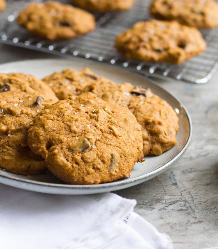 Pumpkin Oatmeal Cookies with Dark Chocolate and Sea Salt are the best way to enjoy the fall baking season. Enjoy with a nice cup of coffee and a comfy blanket.