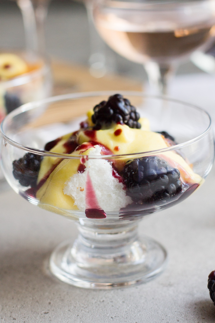 Champagne mousse, or sabayon, is a fast and light dessert served atop angel food cake and topped with blackberries. The perfect light, yet flavorful dessert to be enjoyed in the fall or year round! #ad