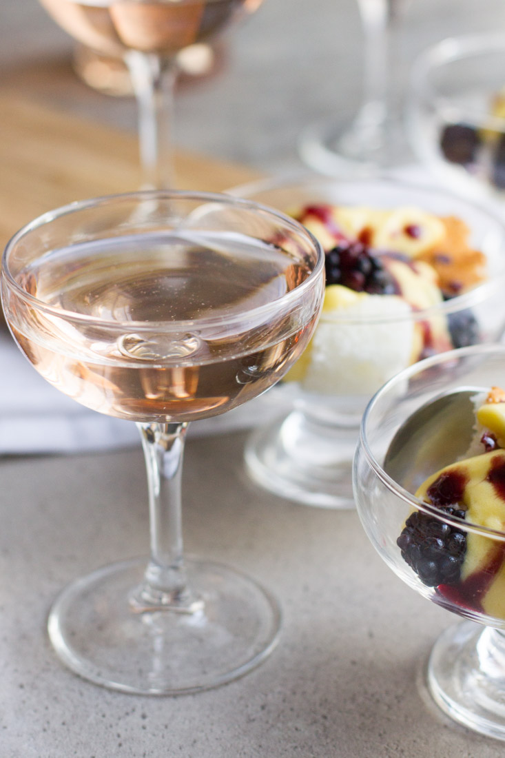 Champagne mousse, or sabayon, is a fast and light dessert served atop angel food cake and topped with blackberries. The perfect light, yet flavorful dessert to be enjoyed in the fall or year round! #ad