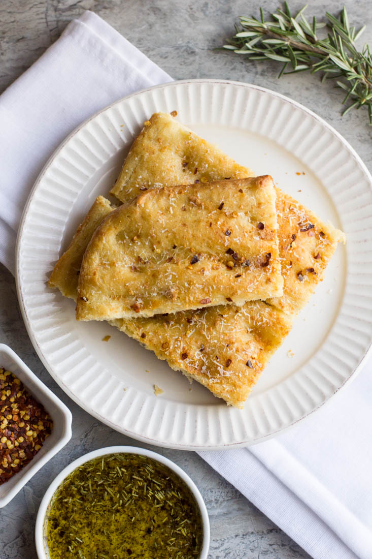 Easily make your own cheesy red pepper focaccia bread at home. The perfect recipe for a beginner. Simple ingredients and no kneading.