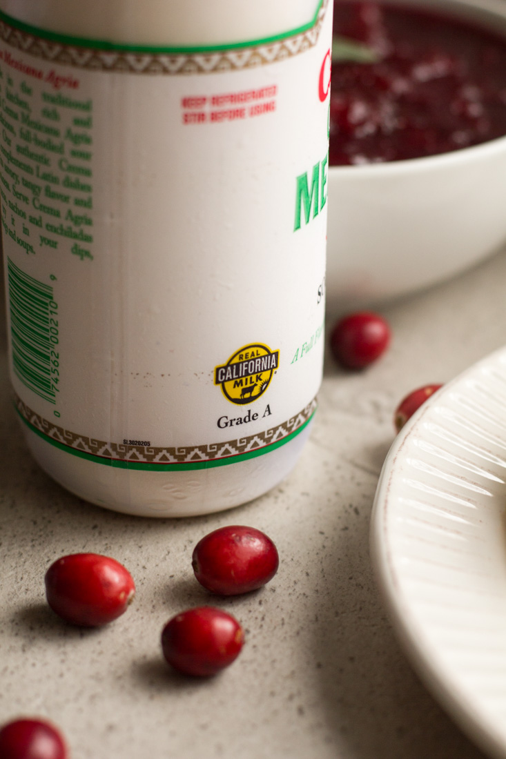 No bake pumpkin cheesecakes make party planning a breeze. Prep these mini cheesecakes and the cranberry topping ahead and chill in the fridge until the big day. Perfect for Thanksgiving and the holiday season. #ad