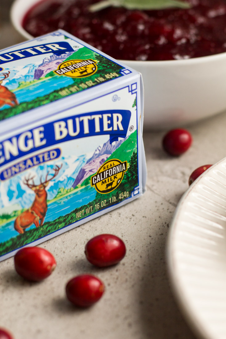 No bake pumpkin cheesecakes make party planning a breeze. Prep these mini cheesecakes and the cranberry topping ahead and chill in the fridge until the big day. Perfect for Thanksgiving and the holiday season. #ad