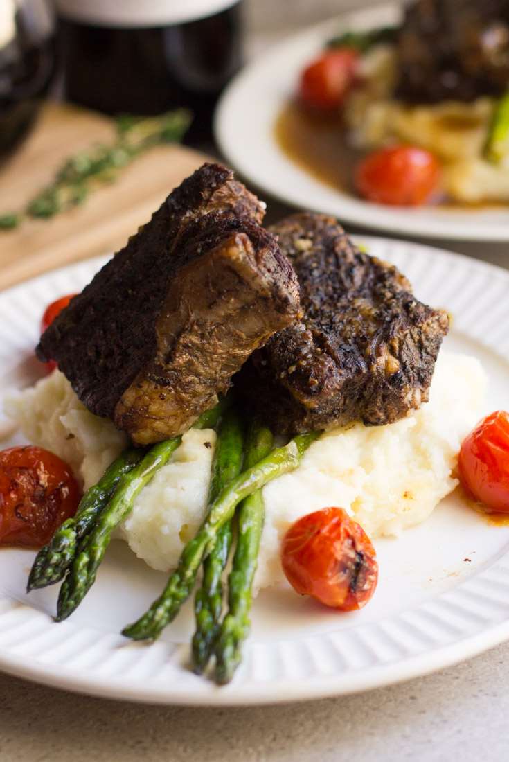 A delicious, decadent and easy dish - this recipe for Slow Cooker Balsamic Braised Short Ribs is excellent for a dinner party or romantic night in. Pair with a glass of your favorite red wine!