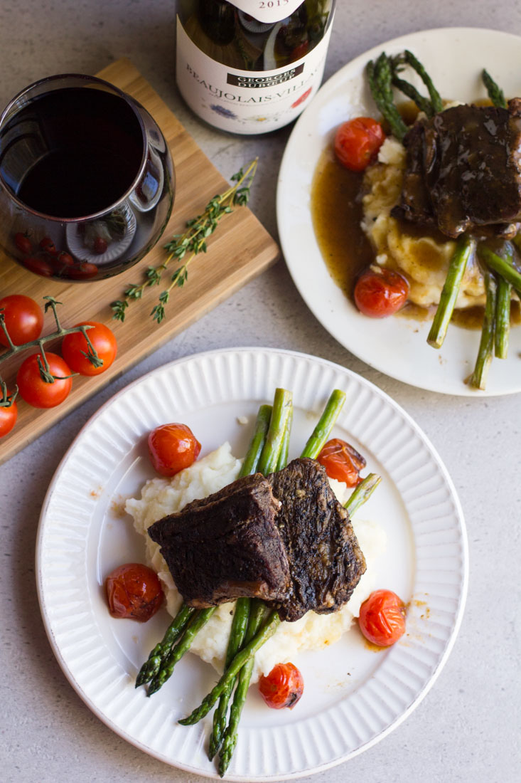 A delicious, decadent and easy dish - this recipe for Slow Cooker Balsamic Braised Short Ribs is excellent for a dinner party or romantic night in. Pair with a glass of your favorite red wine!