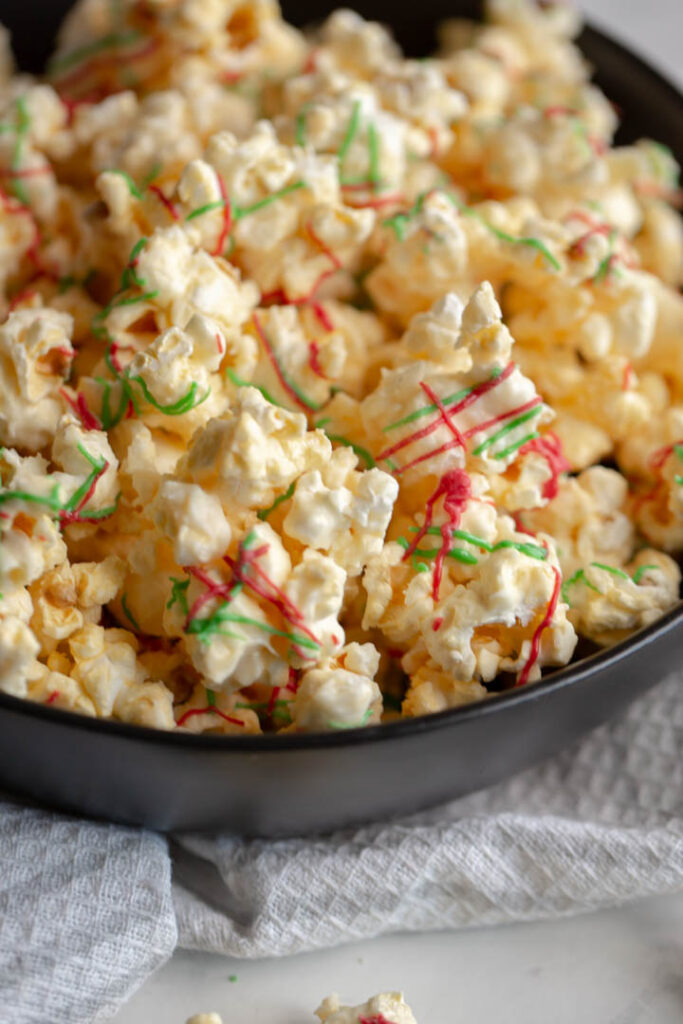 This sweet and salty popcorn recipe is made using white chocolate. It makes the perfect movie night snack, party favor, or christmas gift!