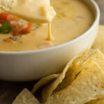 The best Tex Mex style queso, made without Velveeta and Rotel. This is a classic queso found in most restaurants in Texas and is always a huge crowd pleaser!