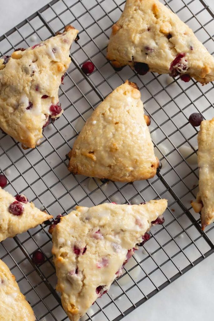 cranberry scones laid on a cooling rack