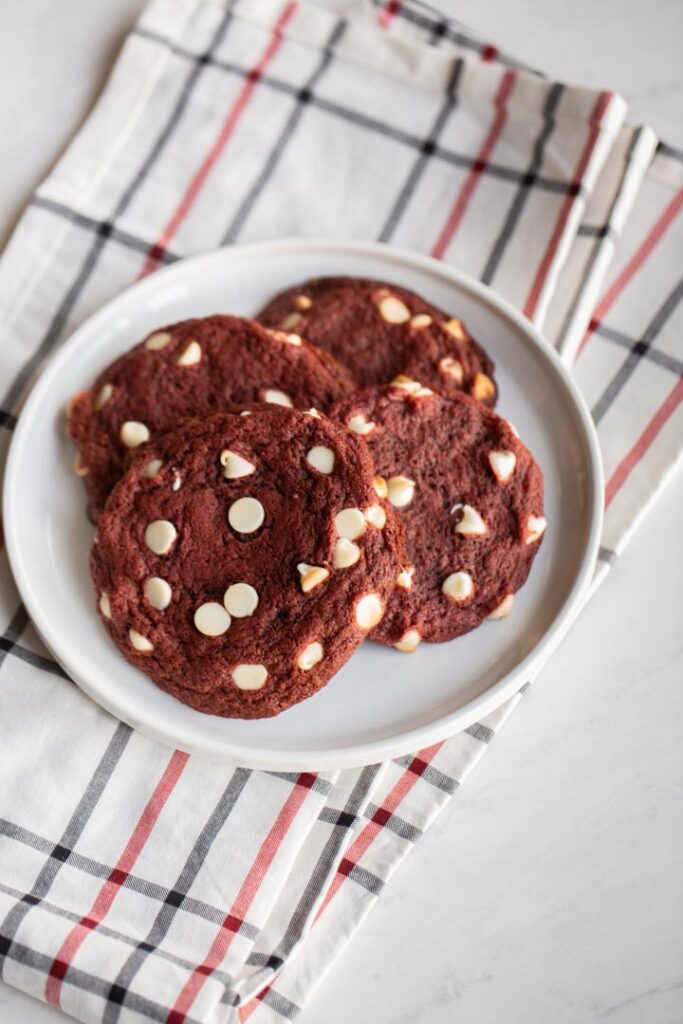 red velvet cookies on a plate on a towel