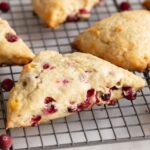 These cranberry scones make the ultimate breakfast pastry. They're soft and moist like a good muffin and flaky like a biscuit. Cranberries make this recipe excellent during the holidays, but can be swapped for other berries throughout the year.
