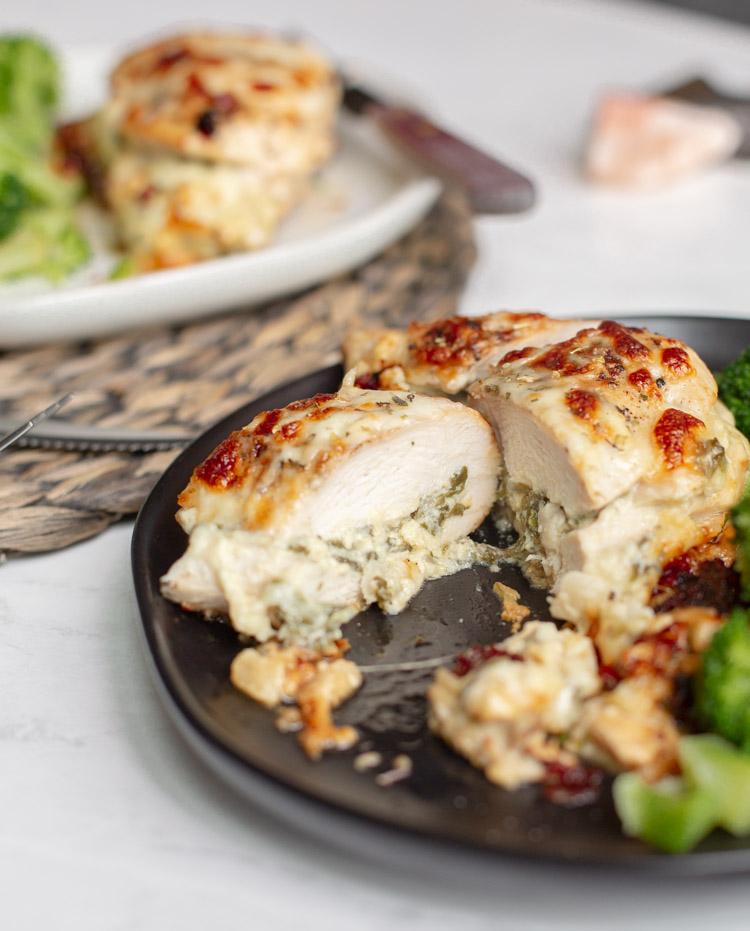 spinach artichoke stuffed chicken on a plate