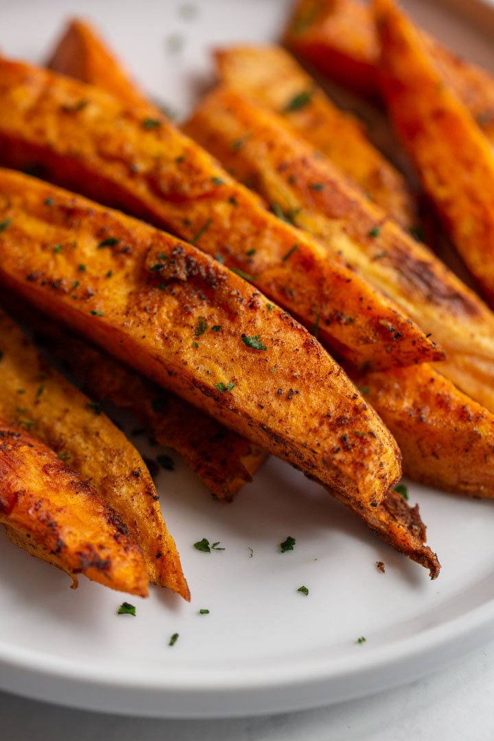 Roasted sweet potato wedges on a plate