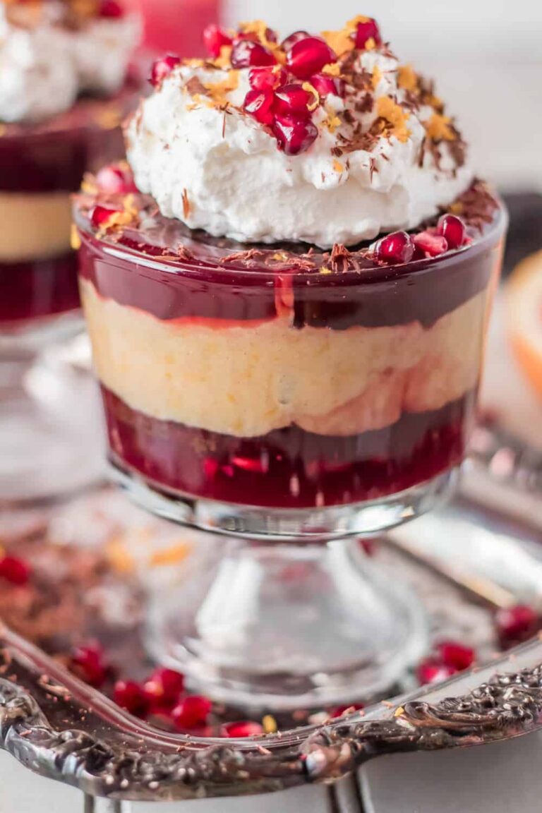 layers of mexican chocolate mousse and pomegranate pudding with pomegranate seeds on top