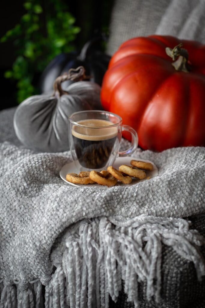 pumpkin spice palmiers and coffee on a blanket with pumpkins