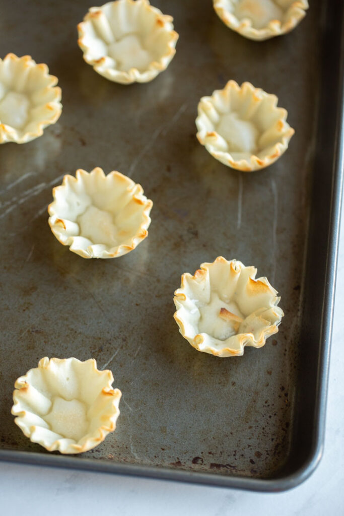 phyllo shells on a pan before baking