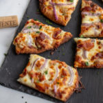 #AD This easy garlic pizza has bacon, onions and a delicious creamy garlic sauce. Great for holiday parties and it pairs nicely with a bottle of white wine, courtesy of Wente! #MakeTime