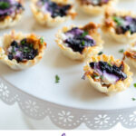 #AD This easy holiday appetizer uses minimal ingredients and yields maximum flavor. Blueberry Goat Cheese Appetizer bites are flaky, delicious and packed with pulled pork and blueberry vanilla goat cheese. #montchevreisgoat