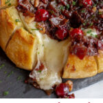 #AD An easy, elegant appetizer perfectly suited for holiday entertaining or sharing with a loved one. This Baked Brie with Cranberries and Bacon is a pull apart bread with Joan of Arc Brie and a cranberry bacon jam. #JoanofArcBrie #BrieFabulous