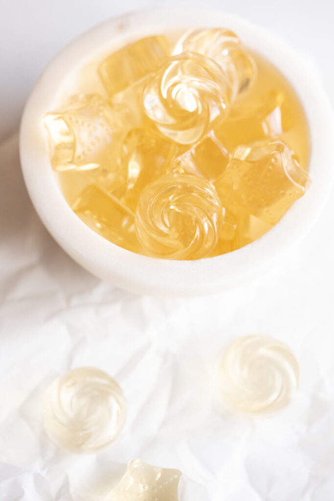 champagne gummies in a bowl