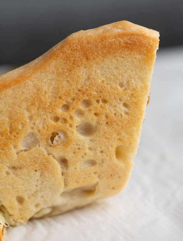 a golden brown pizza crust made from this pizza dough recipe