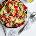 This fajita chicken salad is a mix of grilled fajita chicken, peppers, onions, tomatoes and more laid atop a bed of romaine lettuce and topped with a bright and refreshing avocado lime dressing. 