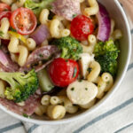 This Italian Pasta Salad is an easy dish to make ahead and bring to a potluck. Packed with salami, cheese, cucumbers, peppers and more, this pasta salad is a total crowd pleaser!