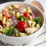 This Italian Pasta Salad is an easy dish to make ahead and bring to a potluck. Packed with salami, cheese, cucumbers, peppers and more, this pasta salad is a total crowd pleaser!