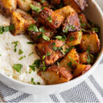 These sheet pan sweet and spicy roasted potatoes shine with flavors of paprika, garlic and rosemary, spiced up and served on ricotta cheese with a drizzle of honey. It's a great interesting side dish to serve to your guests!