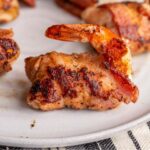 Stuffed Shrimp en Brochette is butterflied shrimp stuffed with jalapeno and cream cheese, wrapped in bacon and grilled to perfection. These are great to serve with BBQ and fajitas!