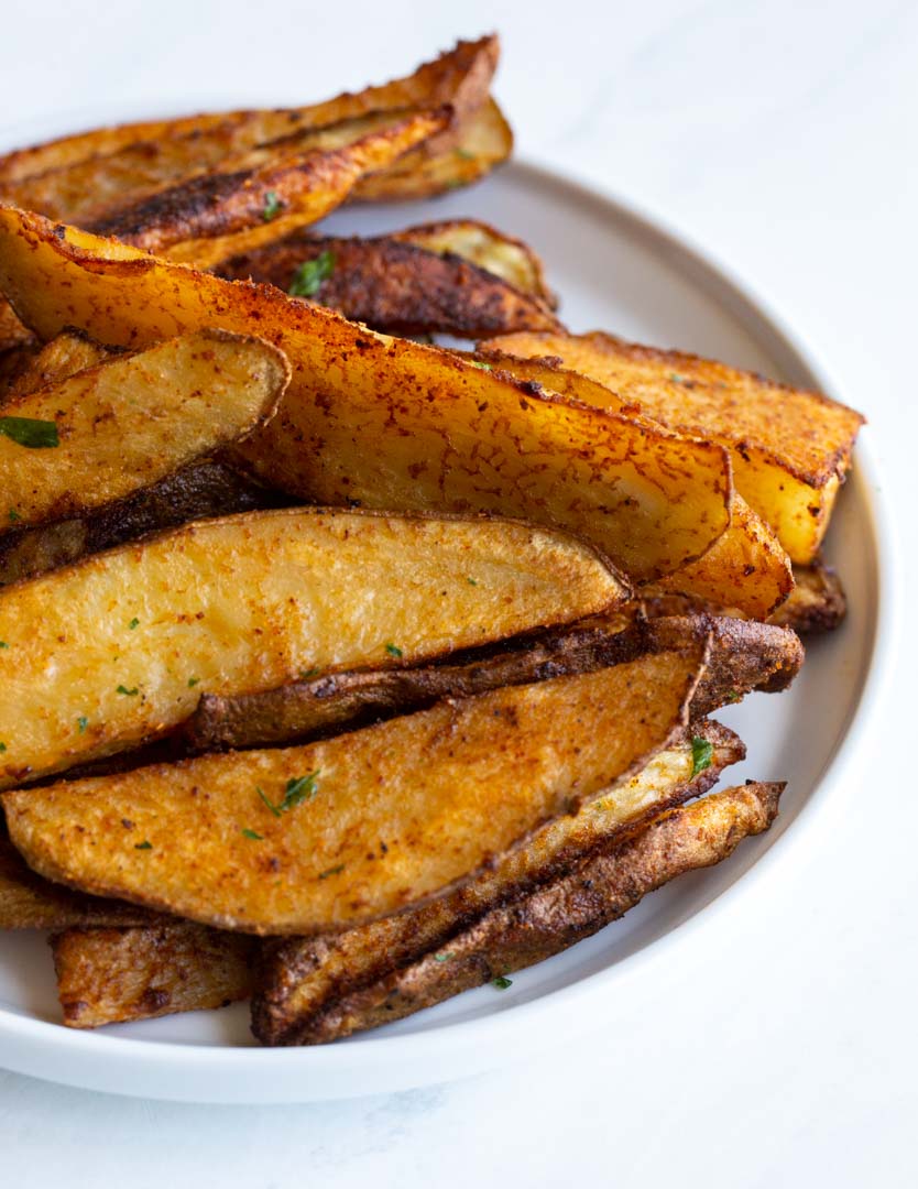 seasoned potato wedges on a plate