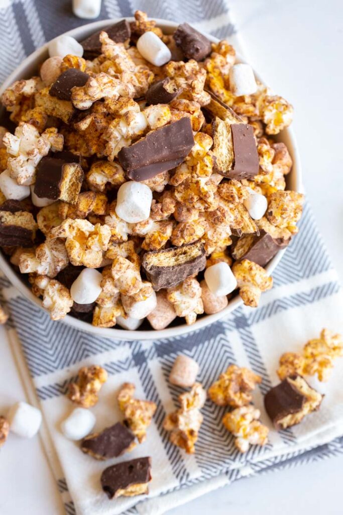 s'mores popcorn with marshmallows and chocolate in a bowl