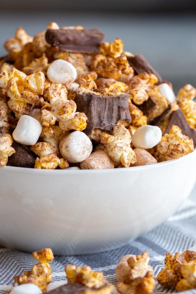 s'mores popcorn in a white bowl