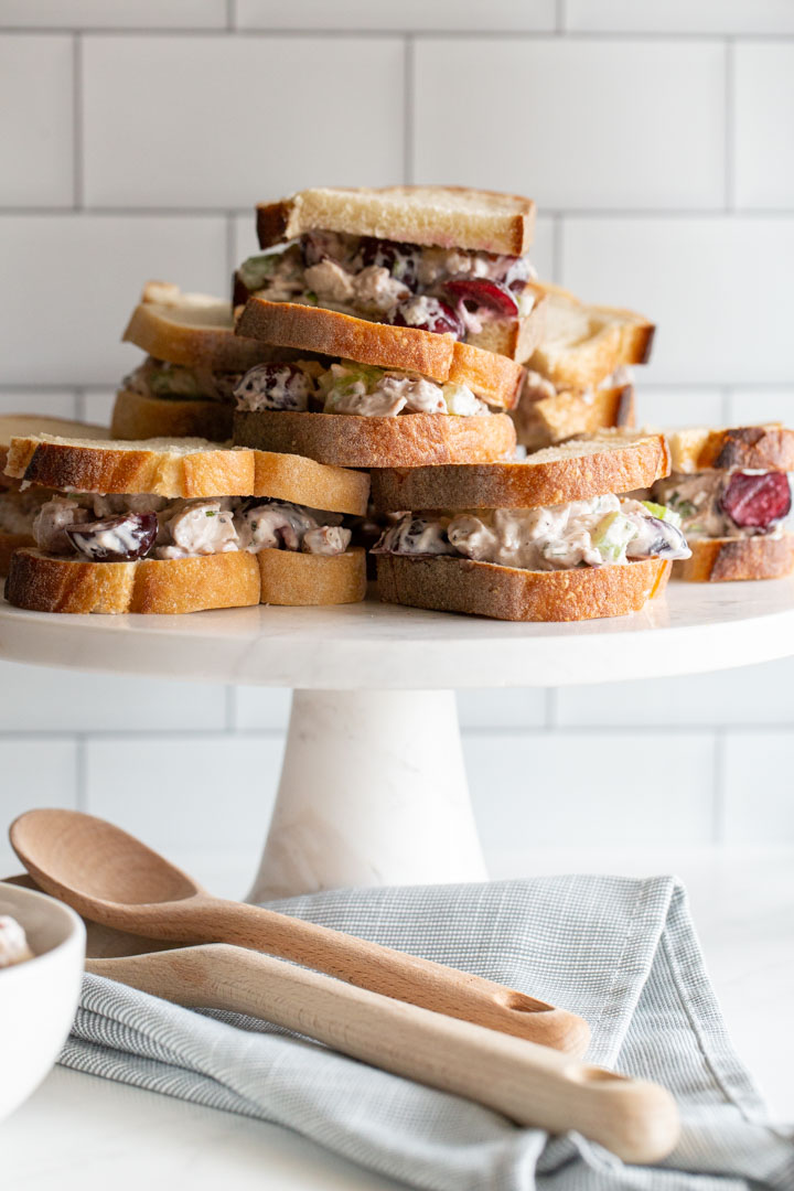 cherry chicken salad sandwiches on a stand