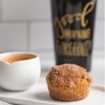 Super easy pumpkin muffins baked and rolled in cinnamon sugar. Perfectly paired with a morning coffee, they're soft, dense, and bursting with flavor!