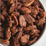 These spicy candied pecans are sweet, spicy, salty and downright addicting. Make them in the slow cooker for an easy, hands-off experience and fill your kitchen with wonderful aromas! They're great for topping salads, party snacks, and even homemade gifts!