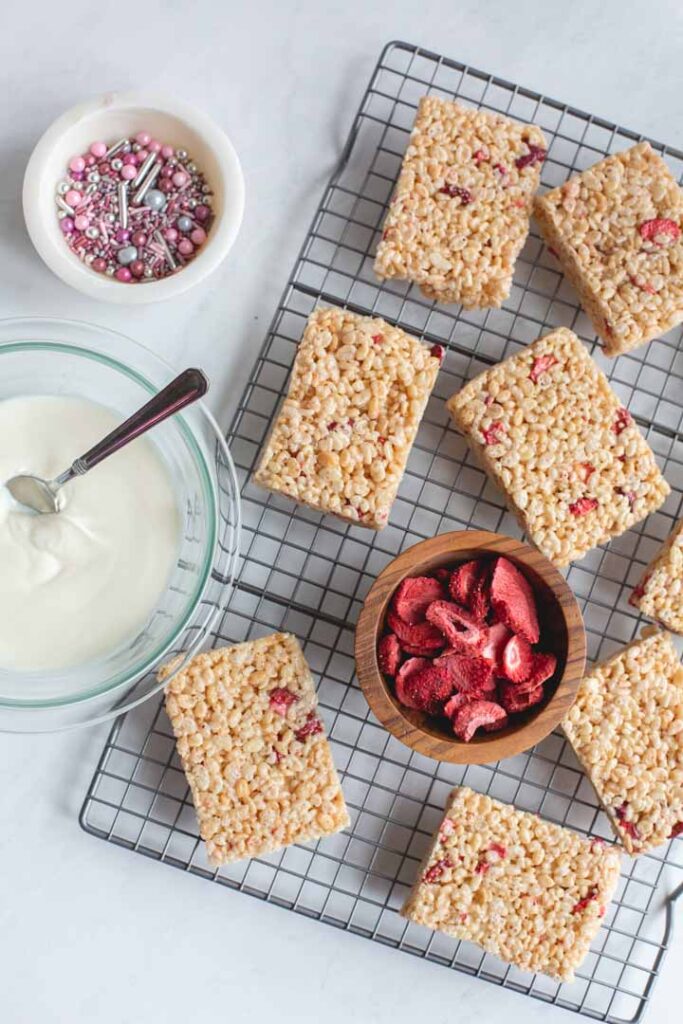 strawberry rice krispie treats waiting to be topped with white chocolate