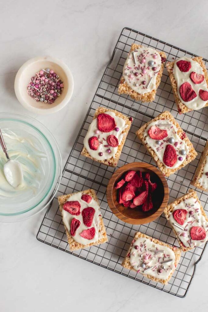 fully decorated strawberry rice krispie treats on a wire rack