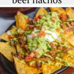 These restaurant style beef nachos are a great way to celebrate all trash fires in life: with chips, seasoned beef, cheese, and more, baked easily in cast iron or on a sheet pan in the oven. Top it with a spicy homemade green fire sauce.