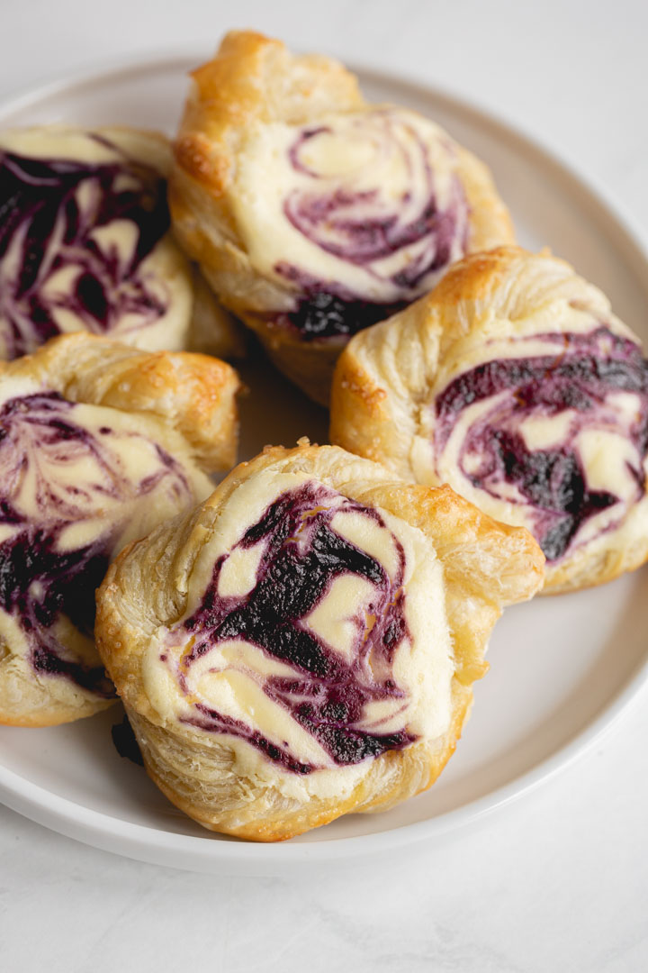 blueberry danishes made with puff pastry swirled with cream cheese and blueberry sauce